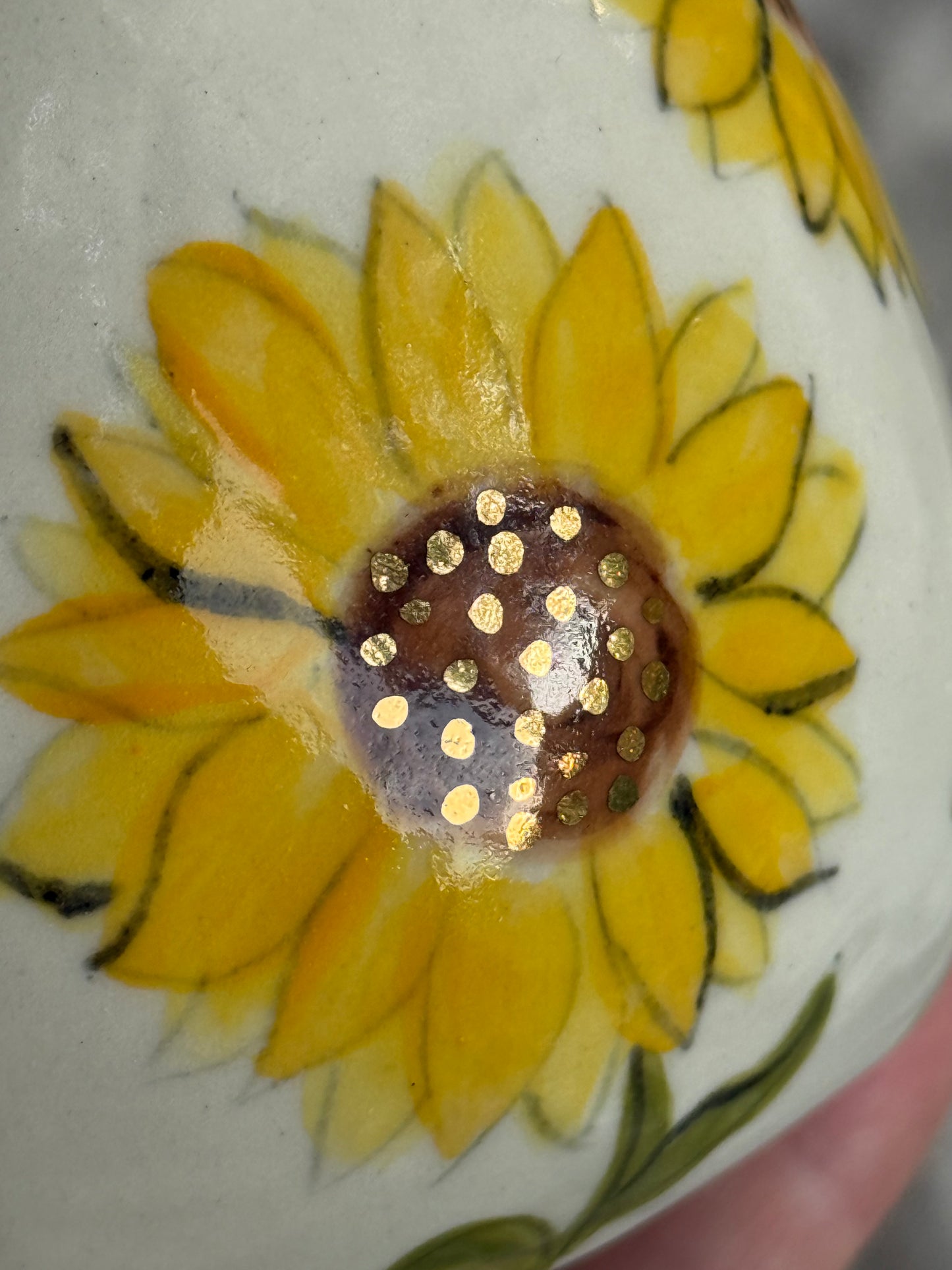 Real golden dots on the sunflower