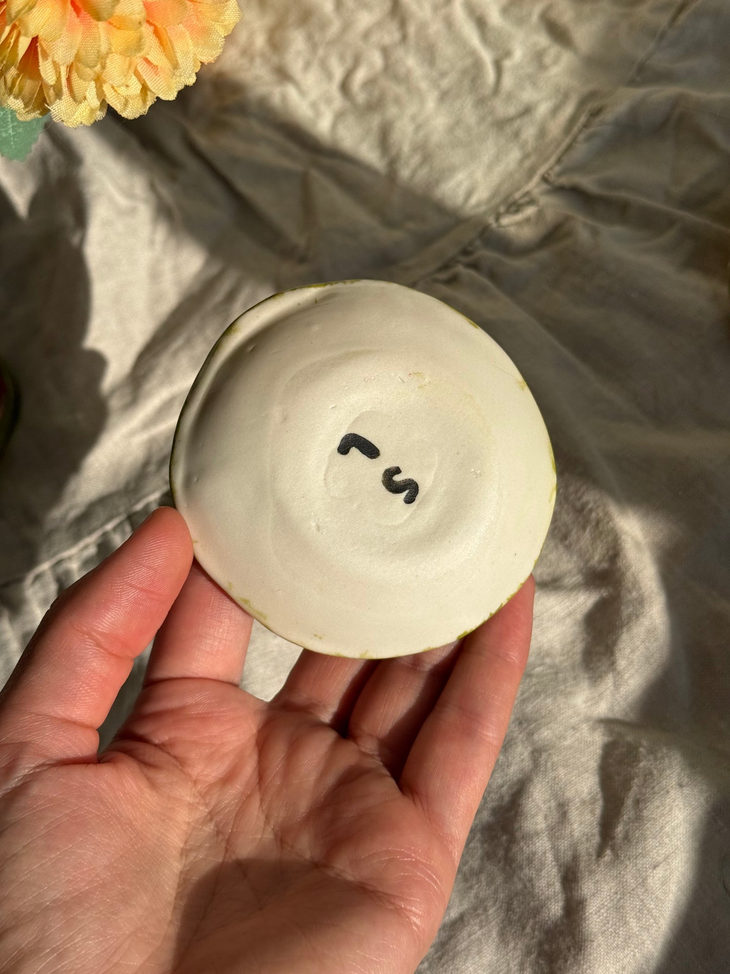 Busy Bee jewelry dish styled with rings - handmade ceramic gift